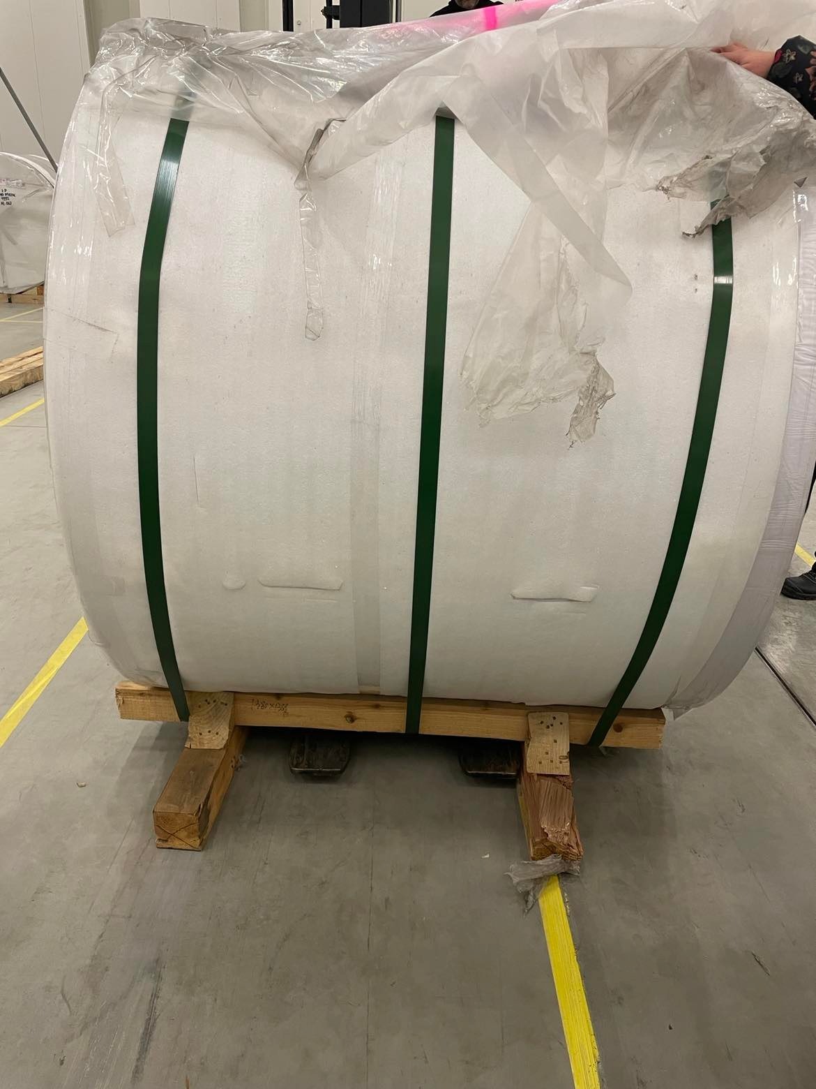 Packaged aluminium coil secured on a wooden pallet
